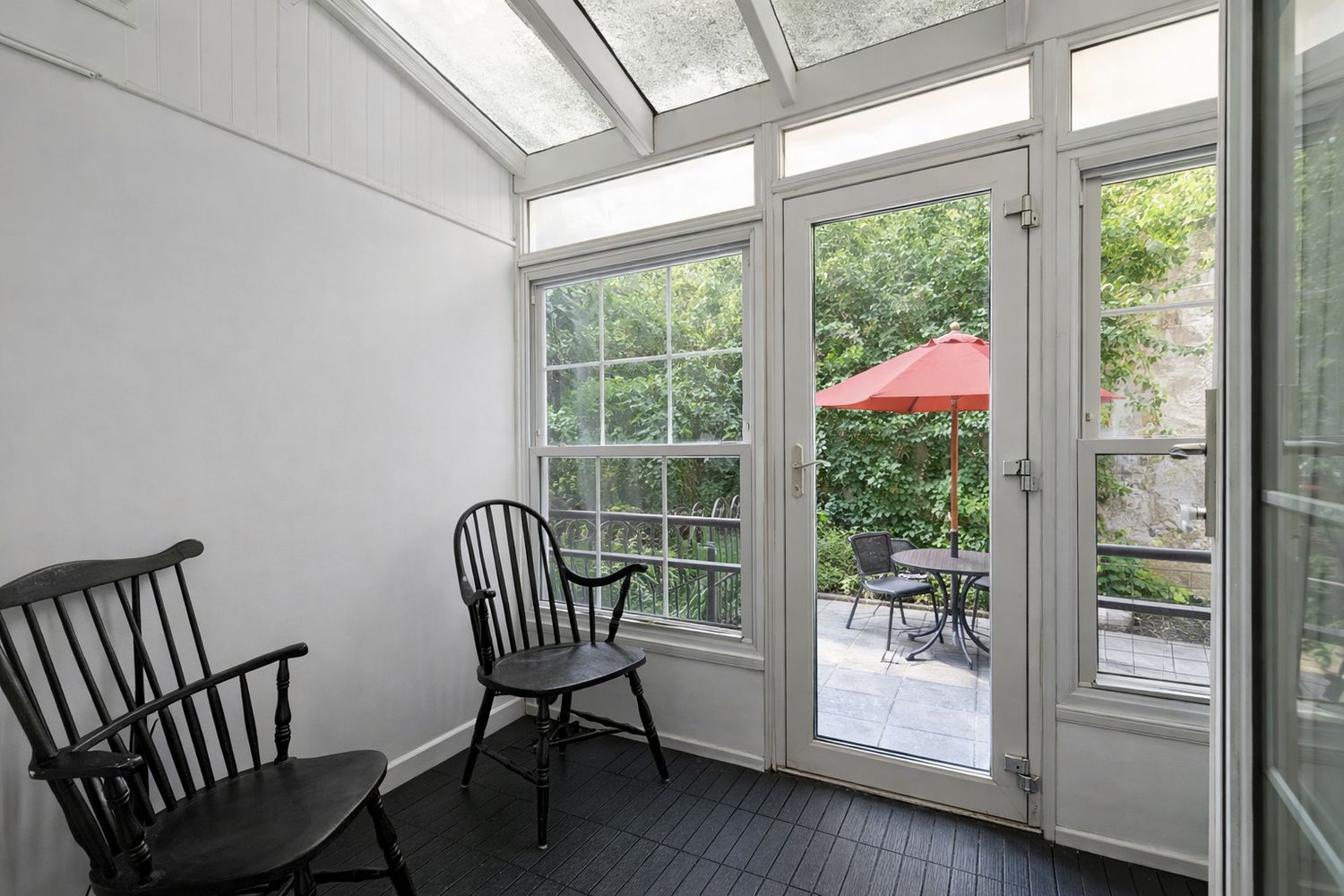 449 1/2 Hudson Street Manhattan, NY 10014 - Photo 5 of 19 a view of a room with furniture and wooden floor
