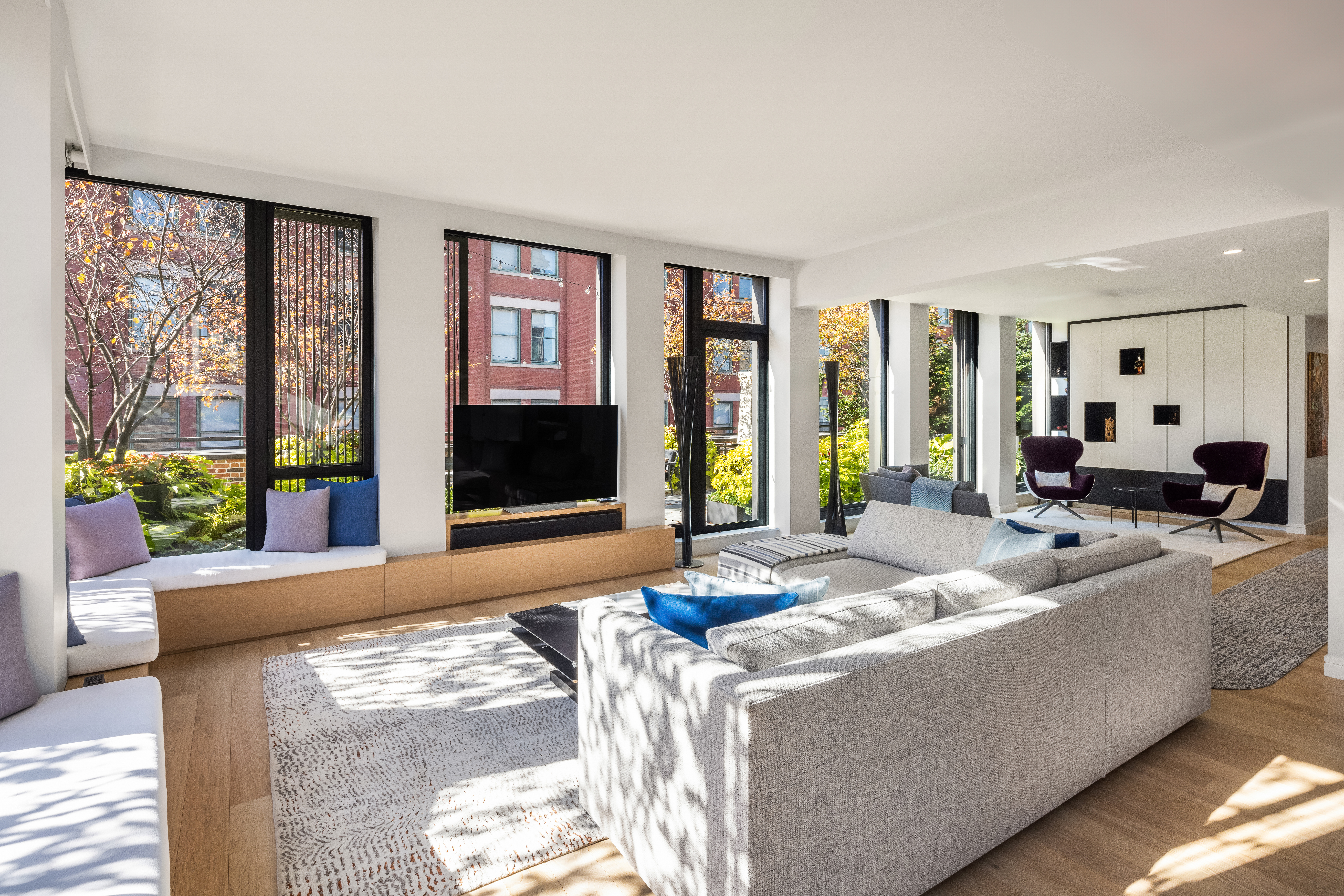 100 Barrow Street, Unit 7/8A Manhattan, NY 10014 - Photo 6 of 23 a living room with furniture and large windows
