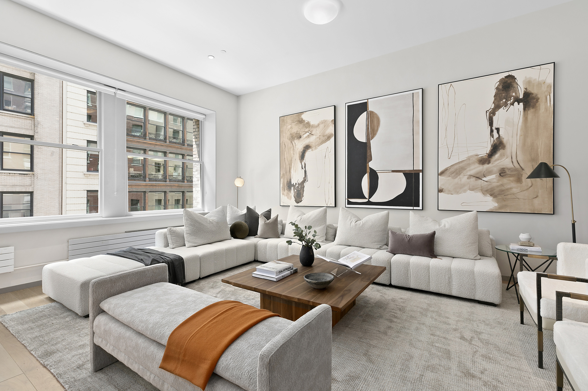 29 West 21st Street, Unit PH Manhattan, NY 10010 - Photo 1 of 17 a living room with furniture and a large window