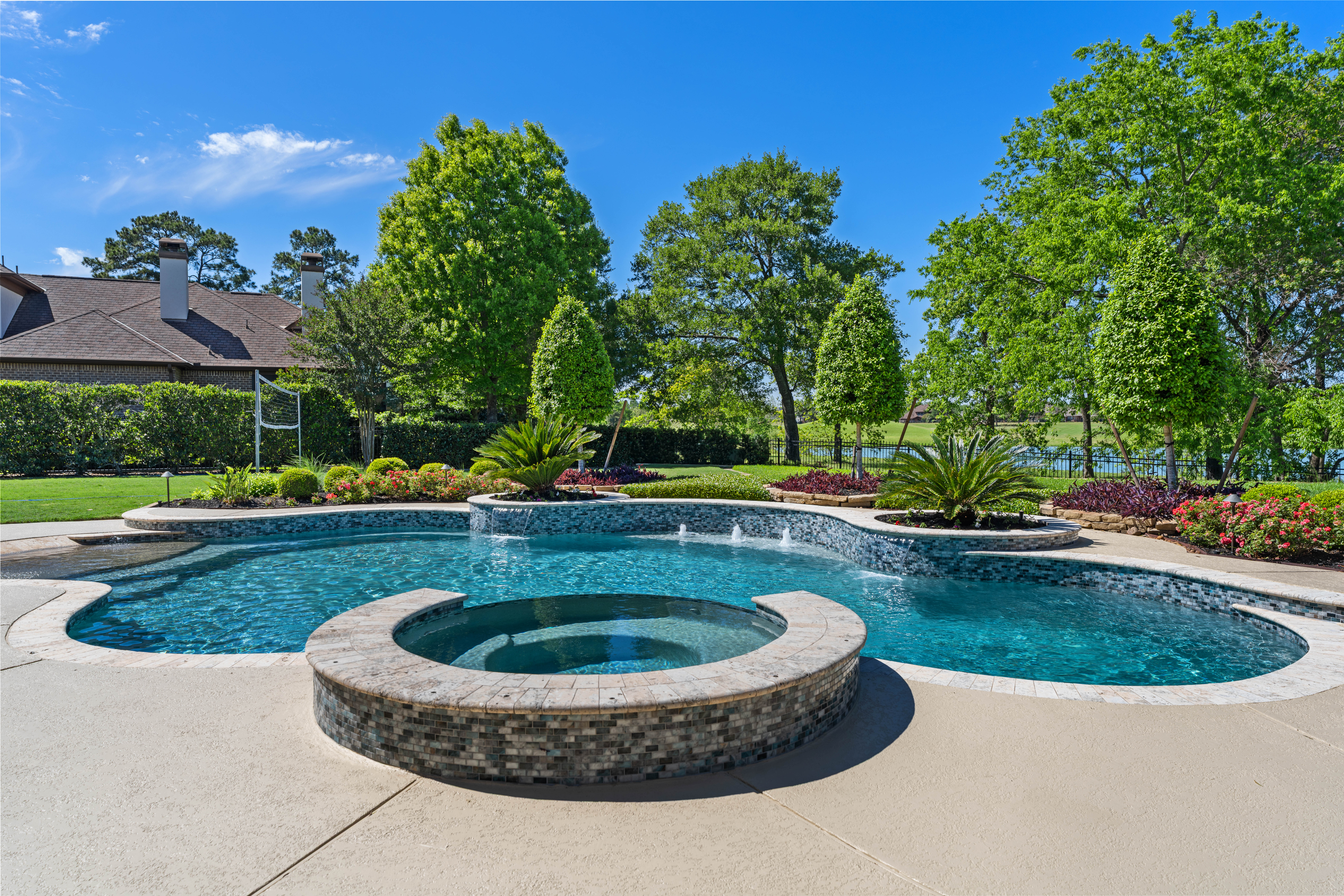 82 Manor Lake Estates Circle Spring, TX 77379 - Photo 39 of 52 a view of a swimming pool with a yard