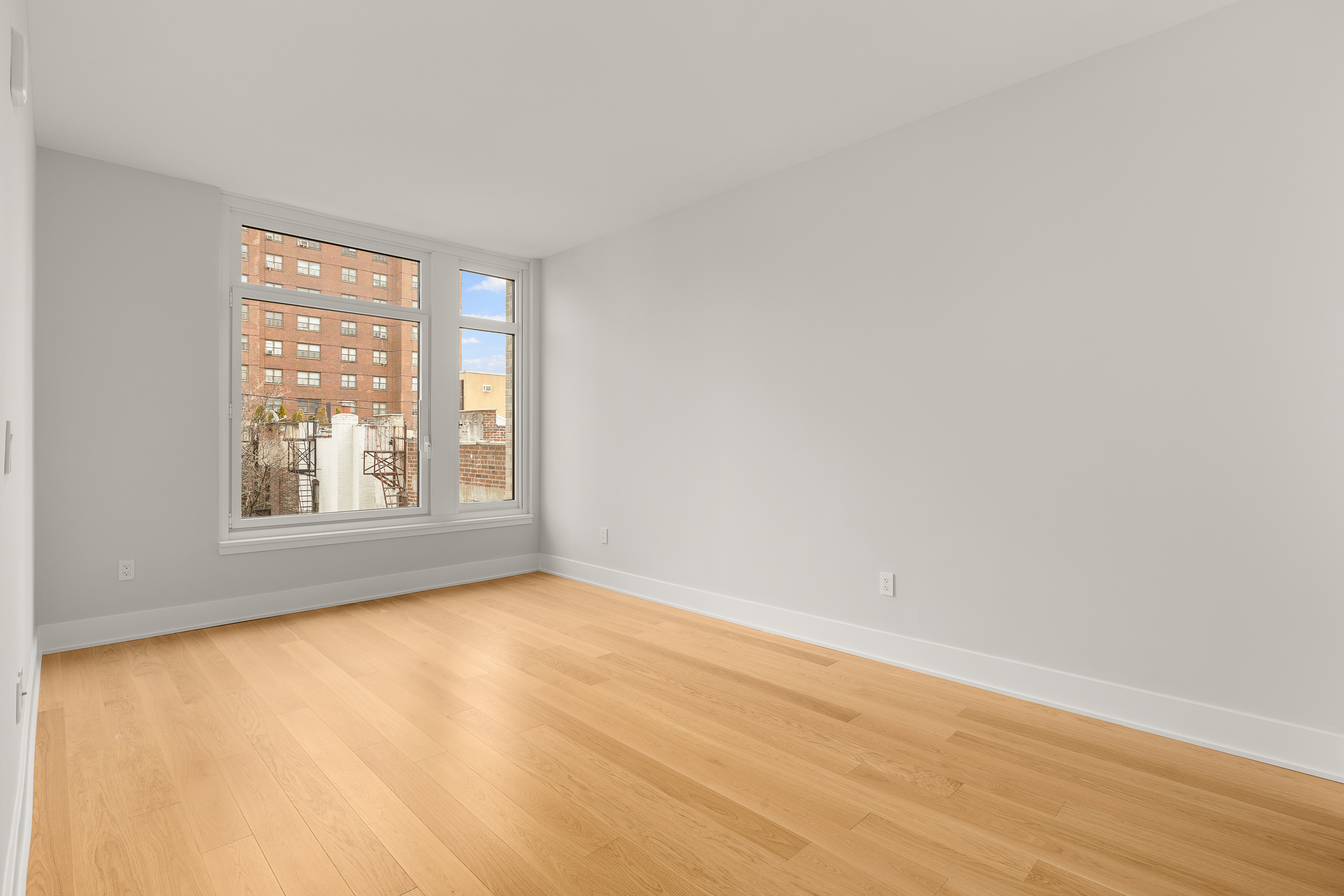 218 West 103rd Street, Unit 6B Manhattan, NY 10025 - Photo 3 of 5 a view of an empty room with a window