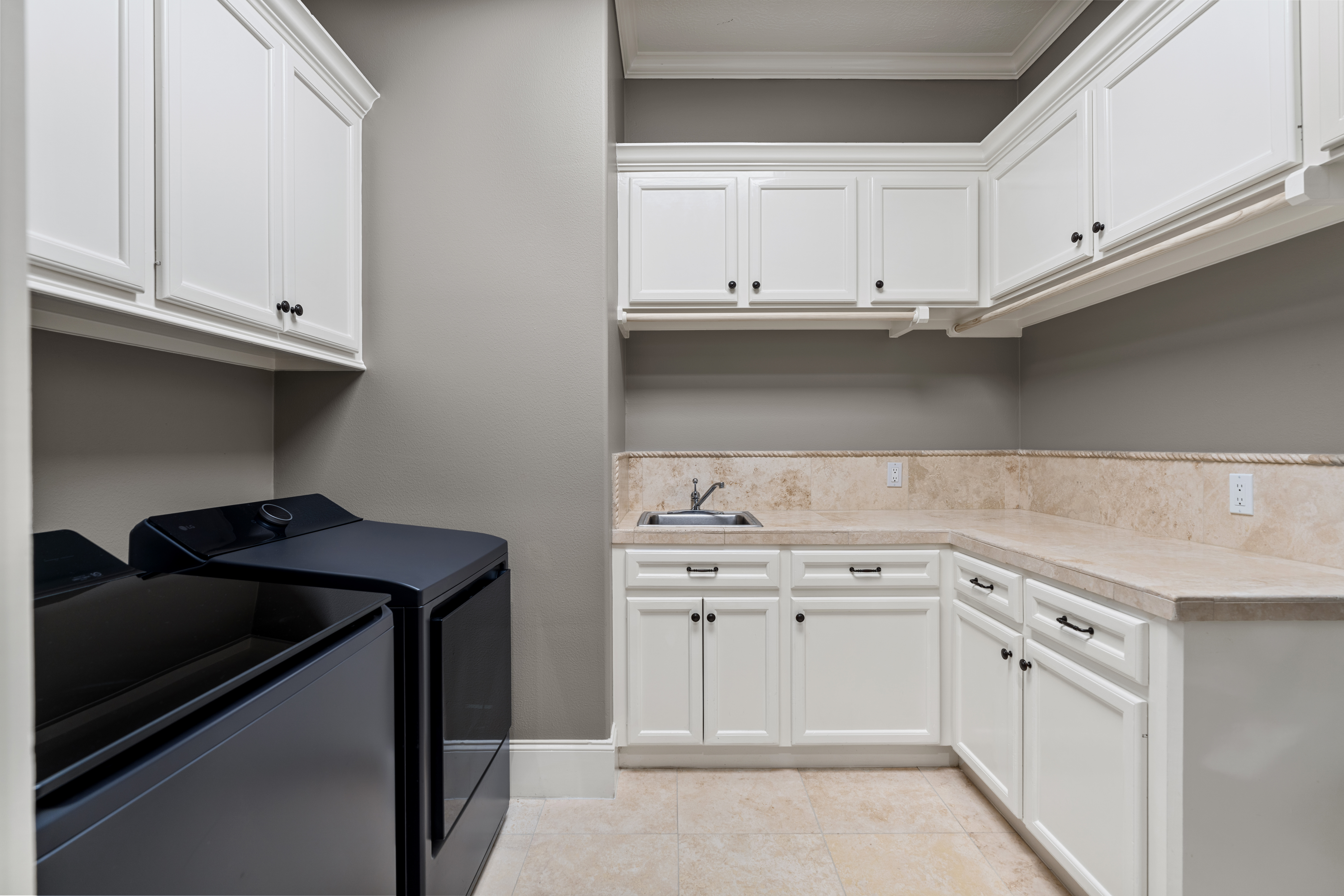 82 Manor Lake Estates Circle Spring, TX 77379 - Photo 22 of 52 a kitchen with white cabinets and a stove