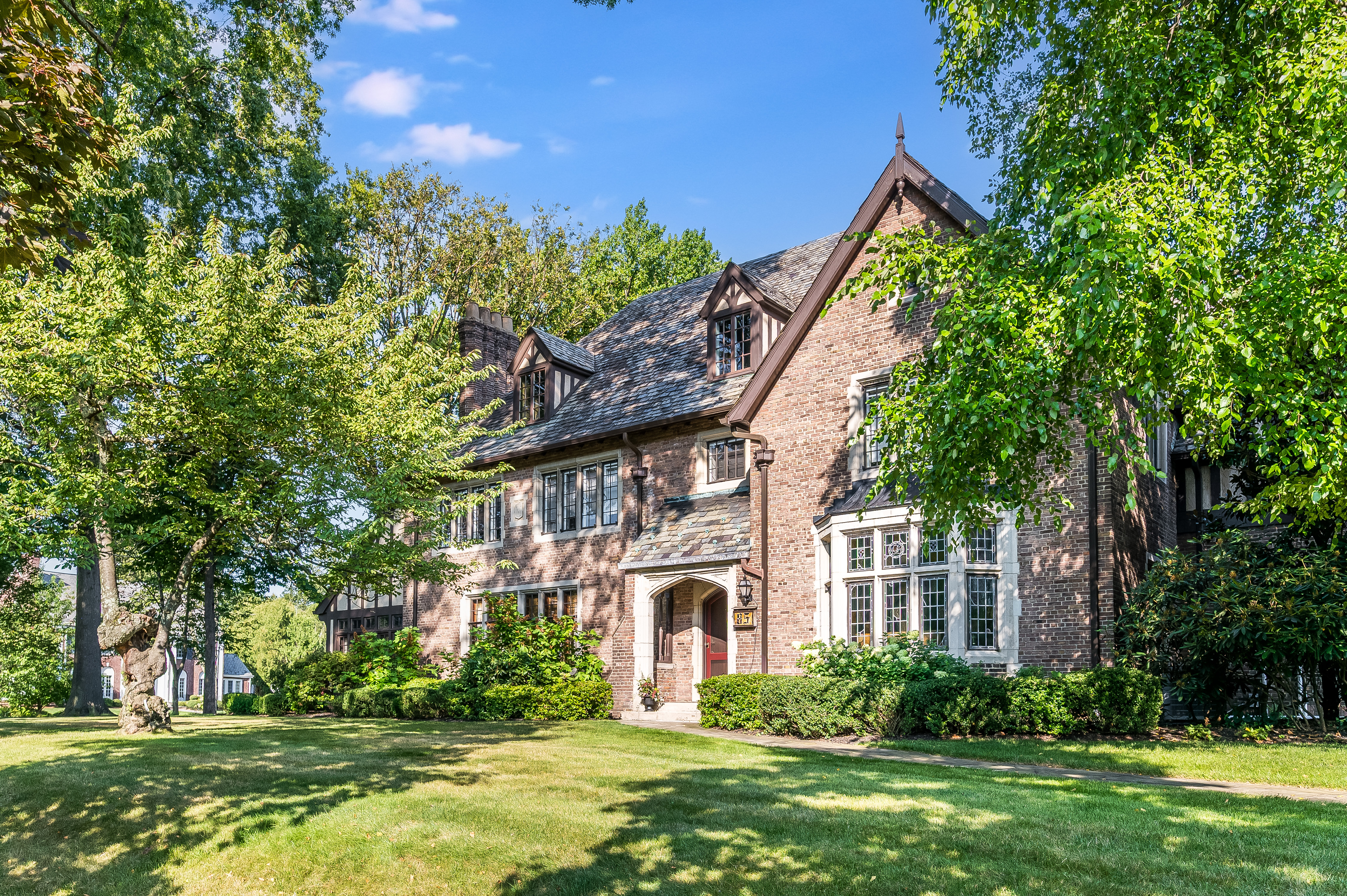 85 Clinton Avenue Montclair, NJ 07042 - Photo 2 of 65 a front view of a house with a garden