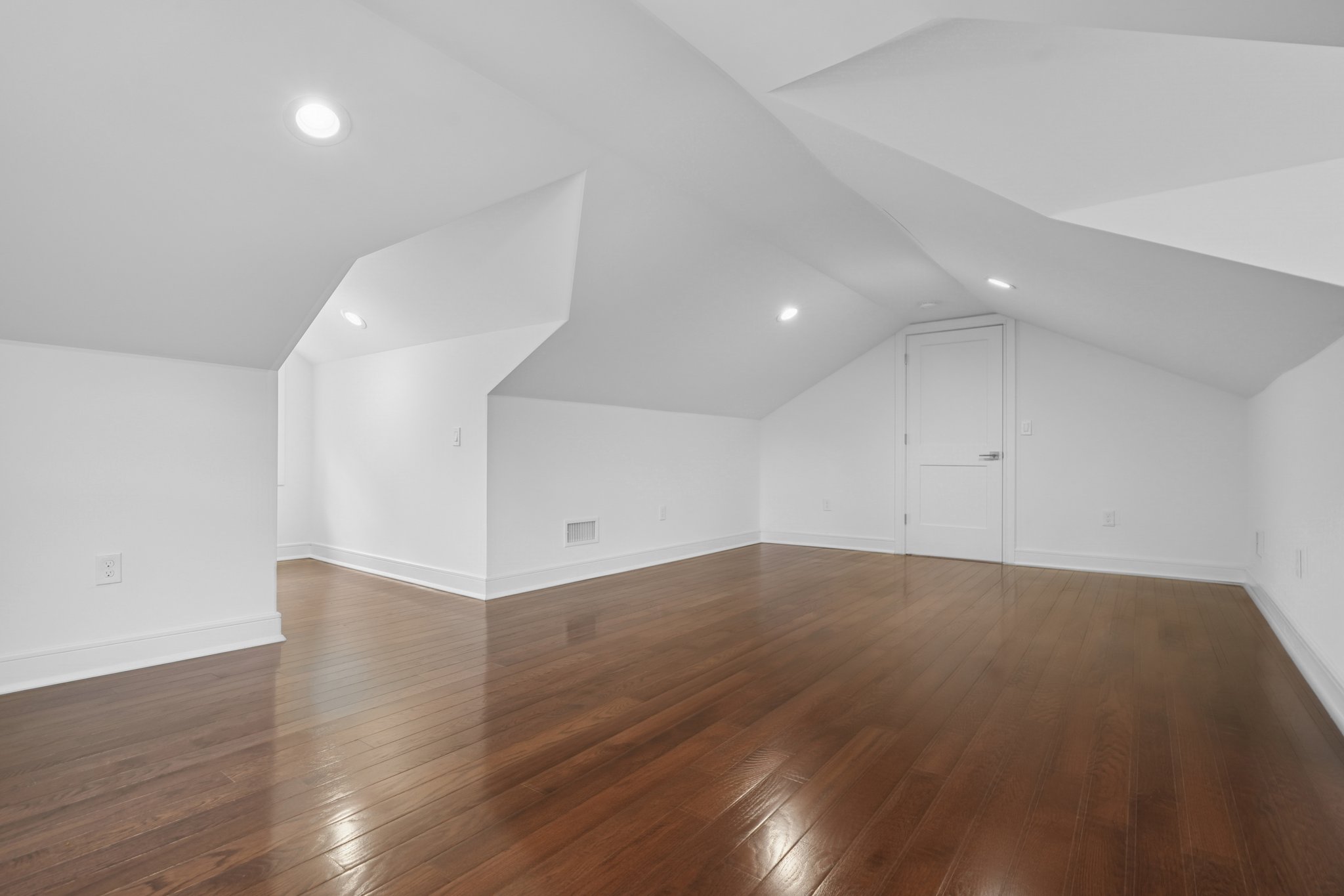 823 River Road Chatham, NJ 07928 - Photo 42 of 60 an empty room with wooden floor and windows