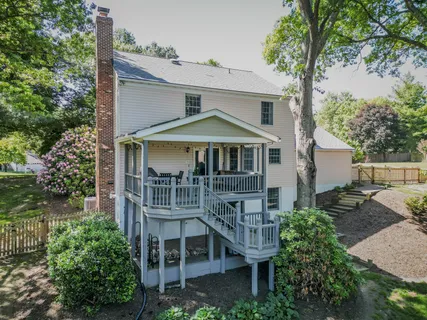 a front view of a house with a yard table and chairs