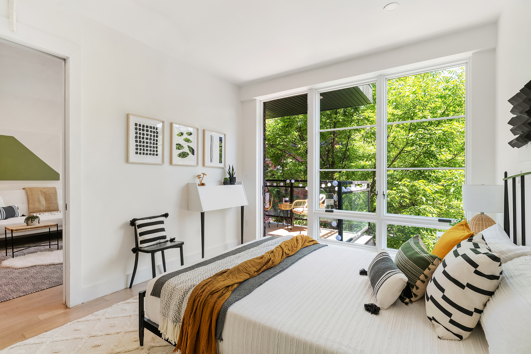 26 West 127th Street, Unit 4A Manhattan, NY 10027 - Photo 4 of 10 a bed room with a bed and a couch