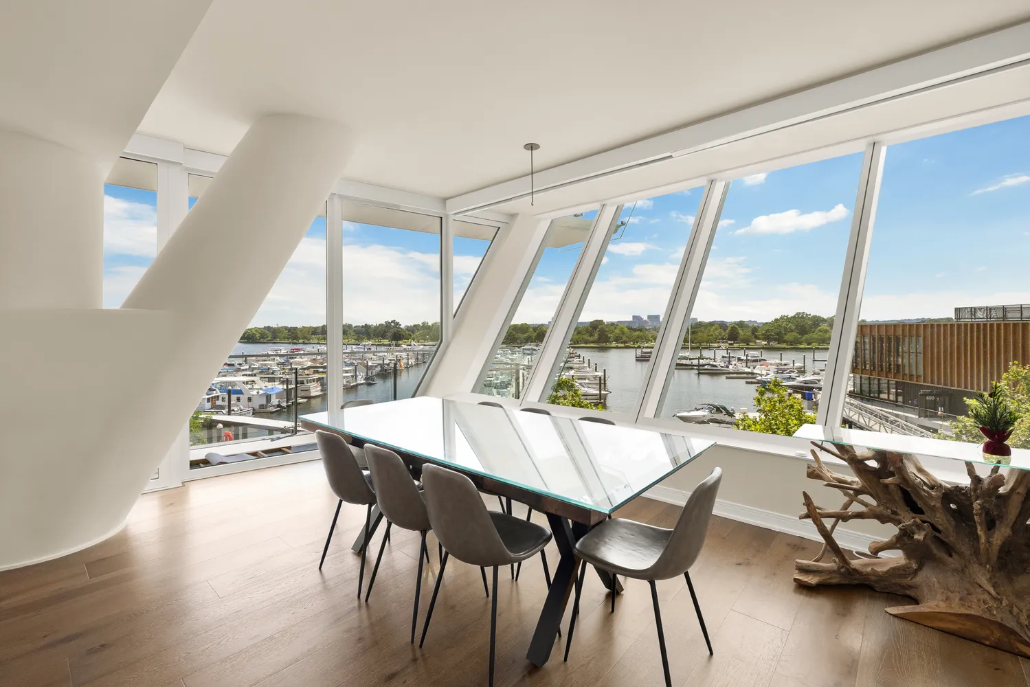 a living room with a table and chairs