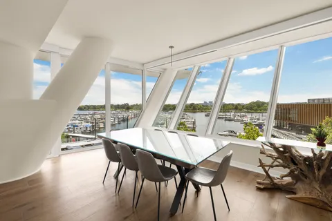 a living room with a table and chairs