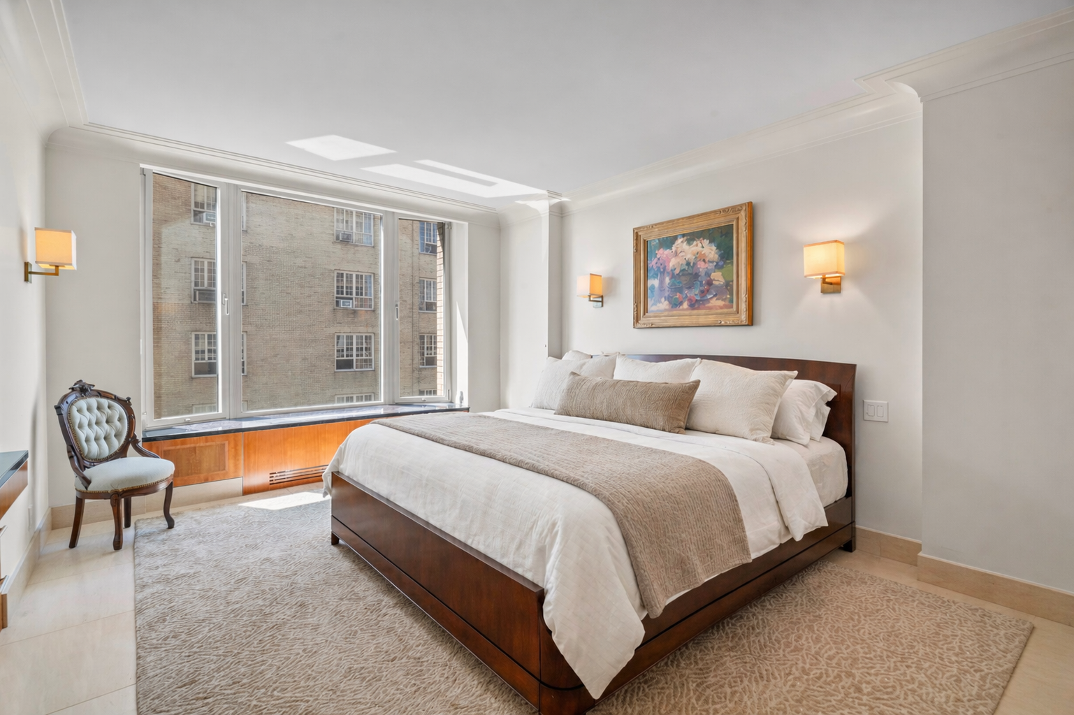 279 Central Park West, Unit 11B Manhattan, NY 10024 - Photo 10 of 24 a spacious bedroom with a bed and a couch next to a window