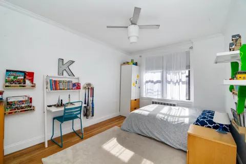 a bedroom with furniture and a window