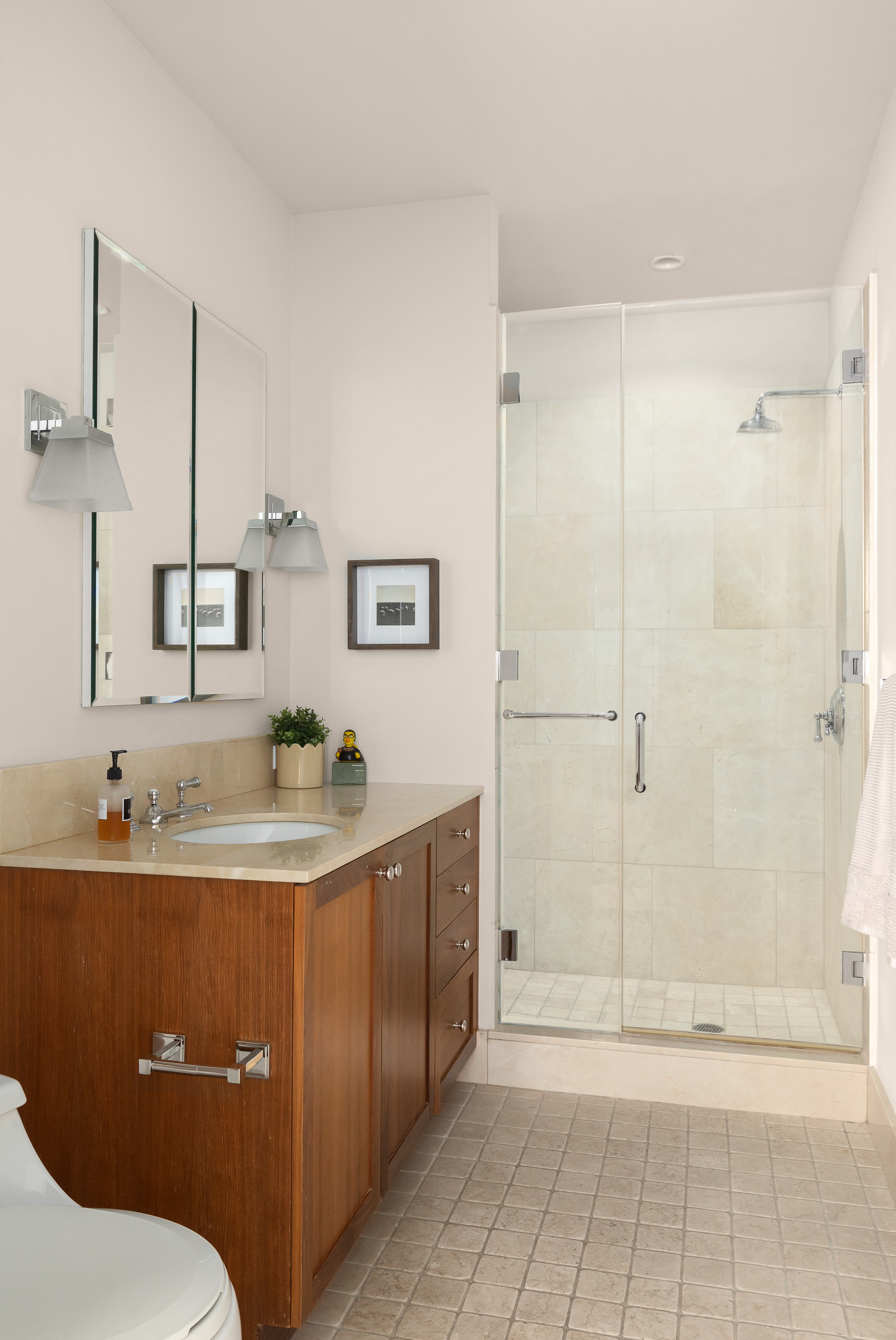 130 West 30th Street, Unit 4C Manhattan, NY 10001 - Photo 14 of 15 a bathroom with a sink a toilet and shower