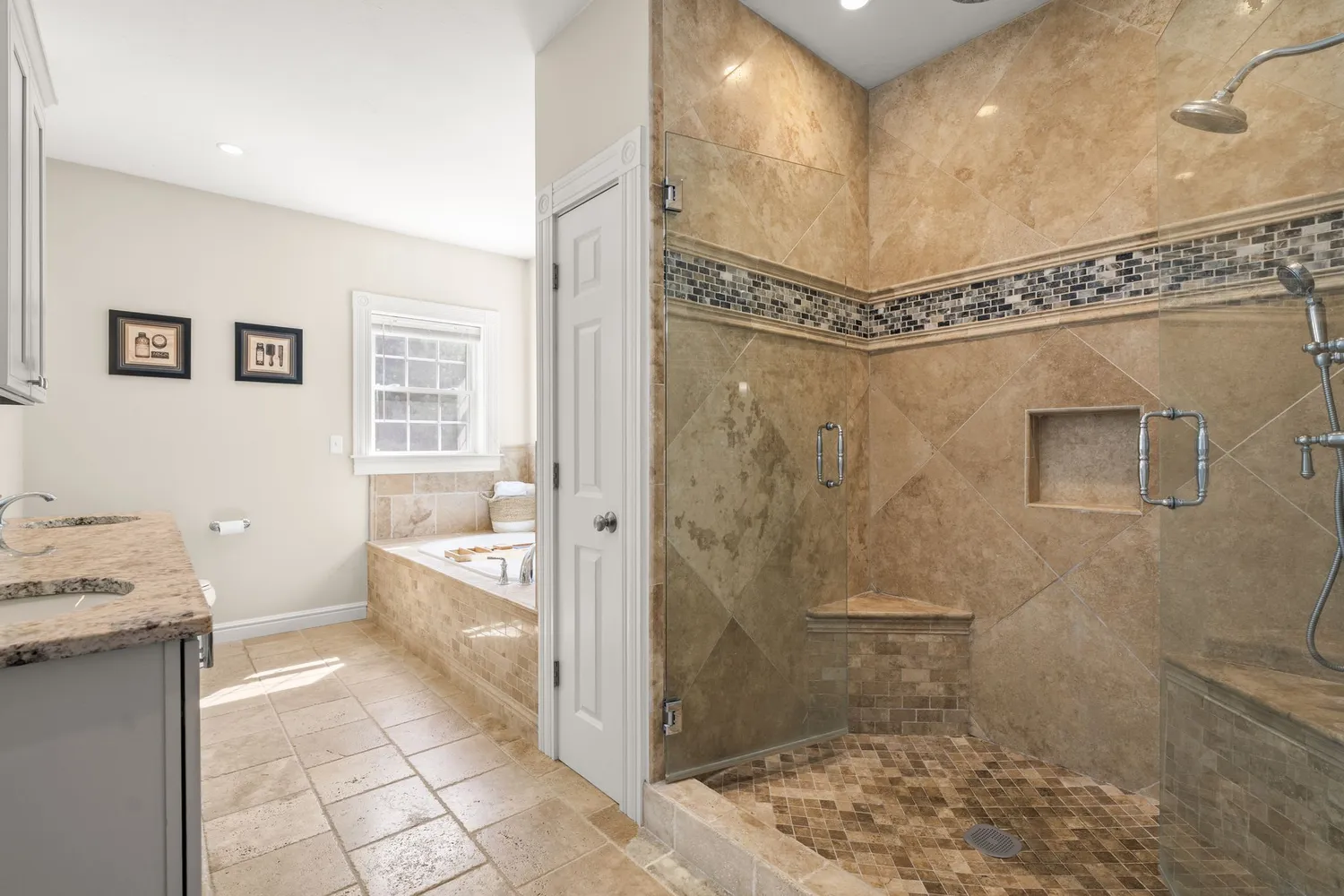 a bathroom with a granite countertop sink a toilet and shower