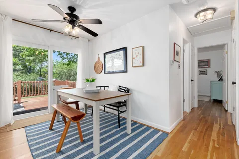 a view of a livingroom with furniture window and wooden floor