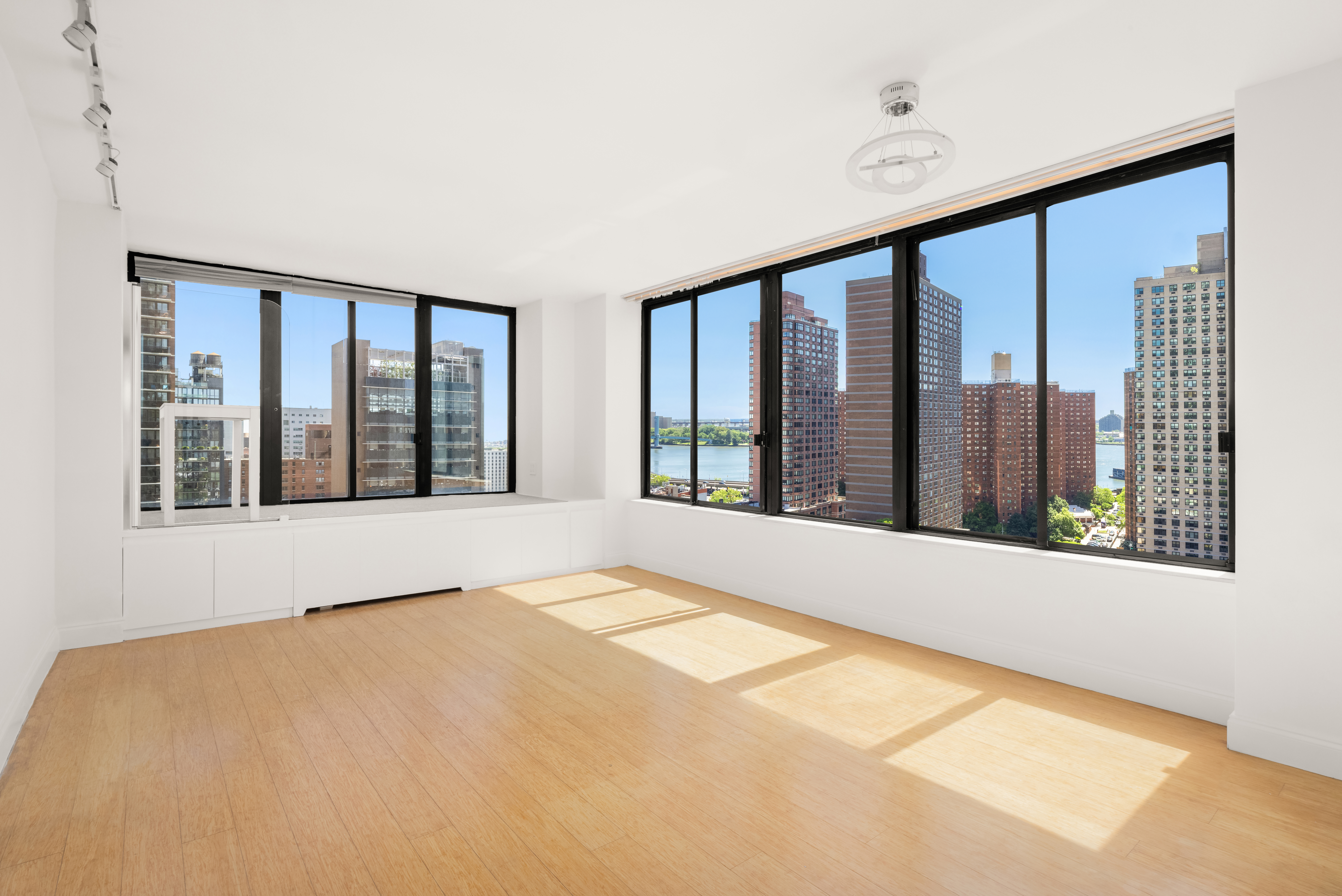300 East 93rd Street, Unit 18E Manhattan, NY 10128 - Photo 7 of 15 a view of an empty room with a large window