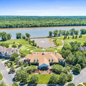 18406 Inverrary Circle Leesburg, VA 20176 - Photo 6 of 10 an aerial view of a houses with a yard and lake view