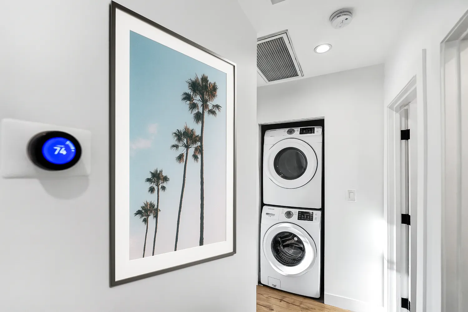 a bedroom with a bed and a potted plant