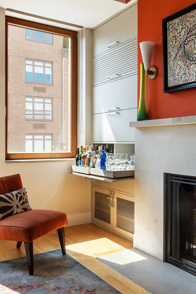 a room with furniture pool table and windows