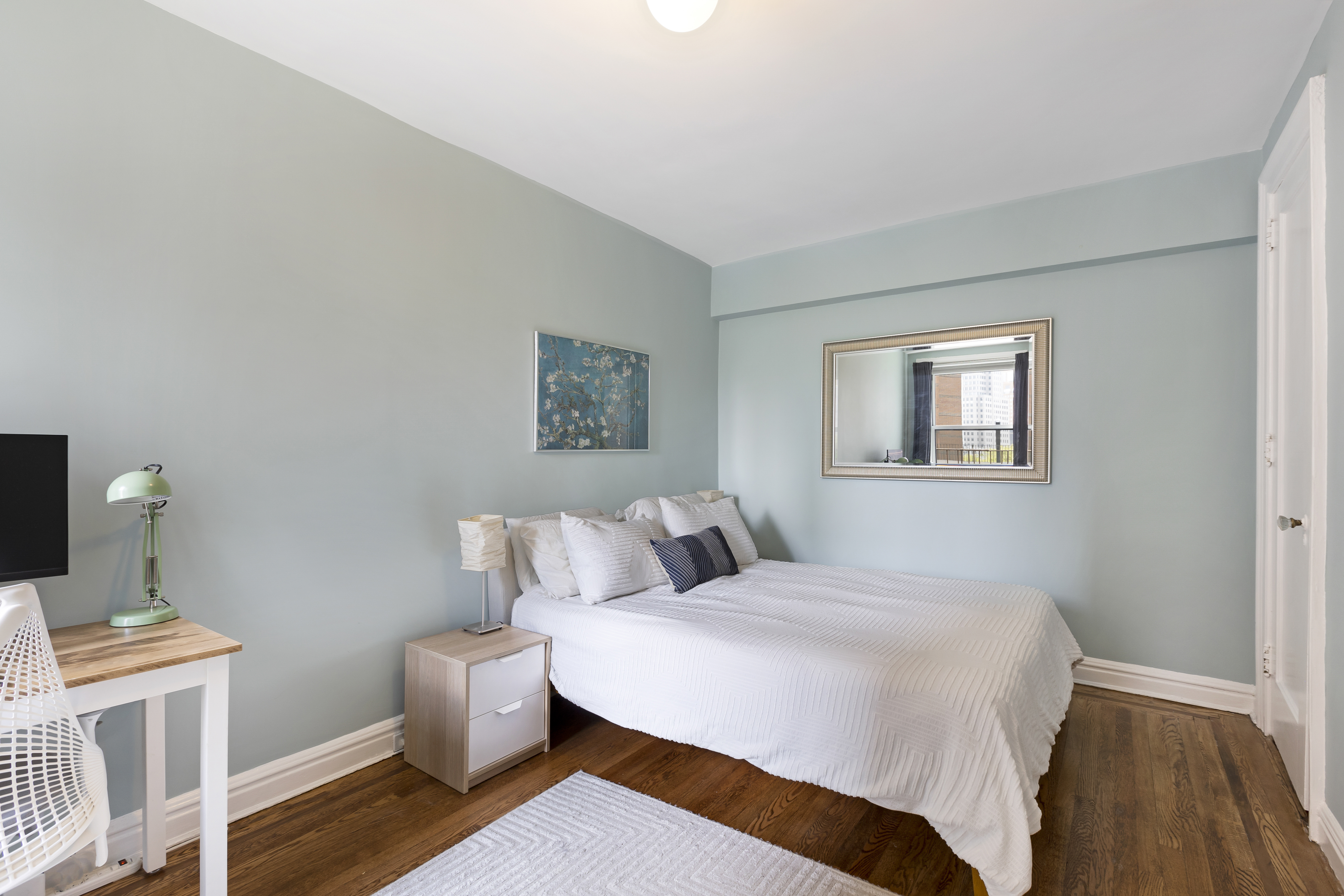 30 Clinton Street, Unit 6A Brooklyn, NY 11201 - Photo 5 of 11 a bedroom with a bed and wooden floor