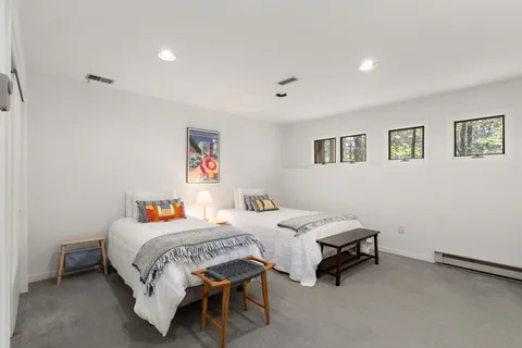 a bedroom with a bed and a cabinets