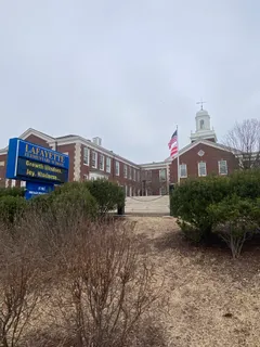 a picture of a building with a yard
