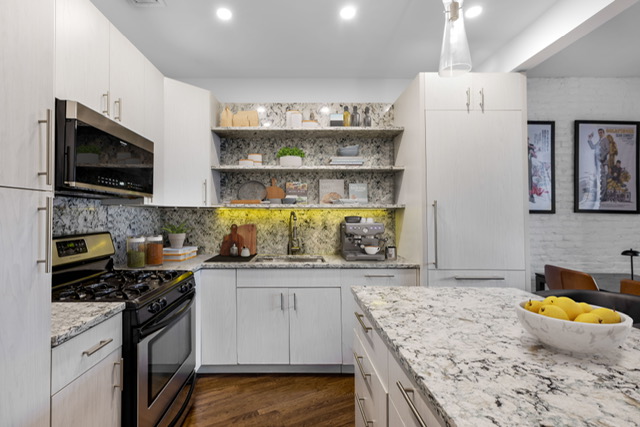 161 Remsen Street, Unit 2C Brooklyn, NY 11242 - Photo 4 of 13 a kitchen with a stove a sink and a microwave