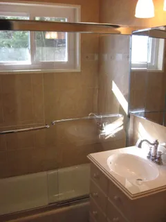 a bathroom with a sink and a window