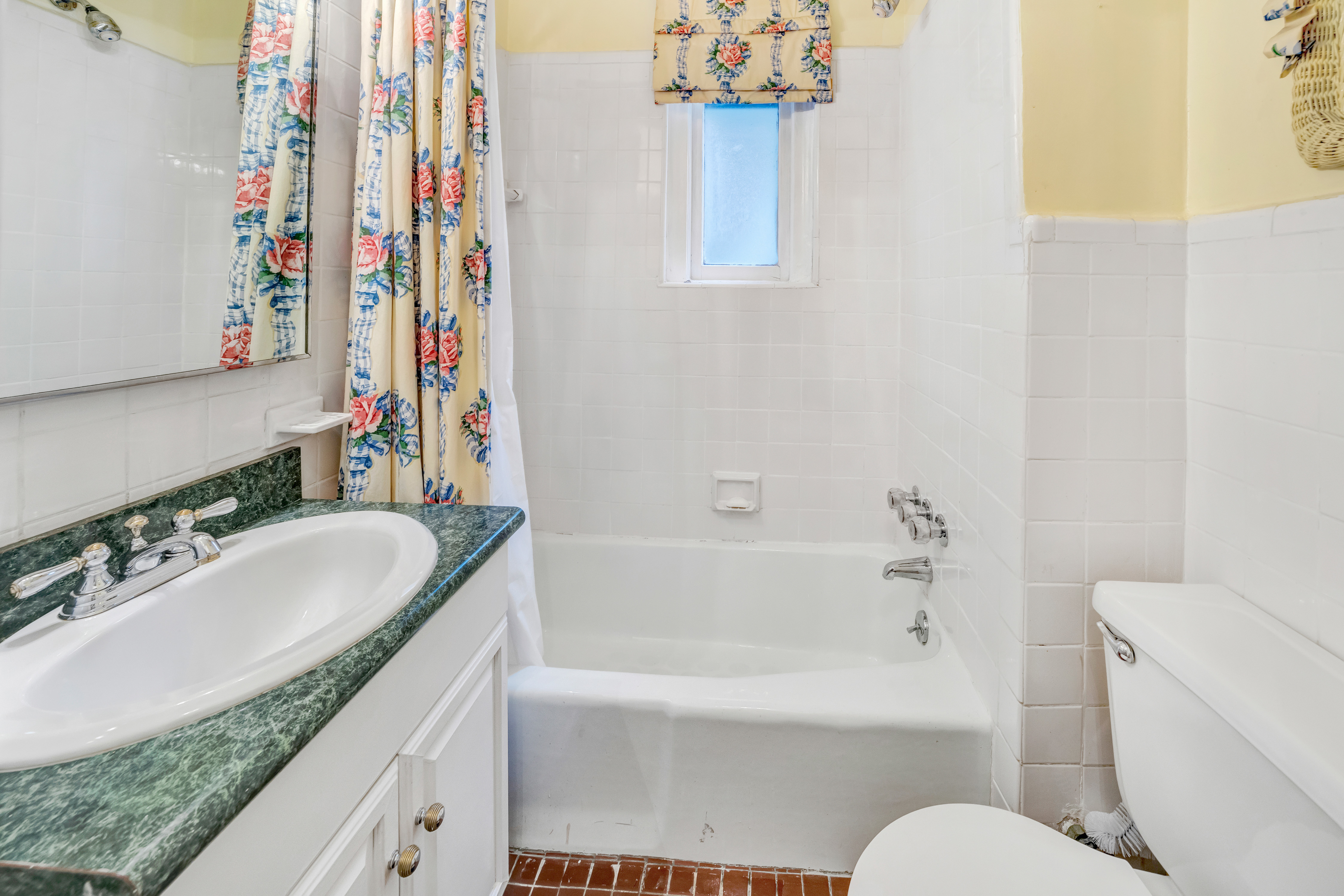 1060 Park Avenue, Unit 3B Manhattan, NY 10128 - Photo 6 of 8 a bathroom with a granite countertop sink and a mirror