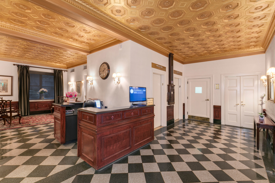 162 West 56th Street, Unit 1102 Manhattan, NY 10019 - Photo 8 of 12 a kitchen with stainless steel appliances granite countertop a stove a sink and a refrigerator