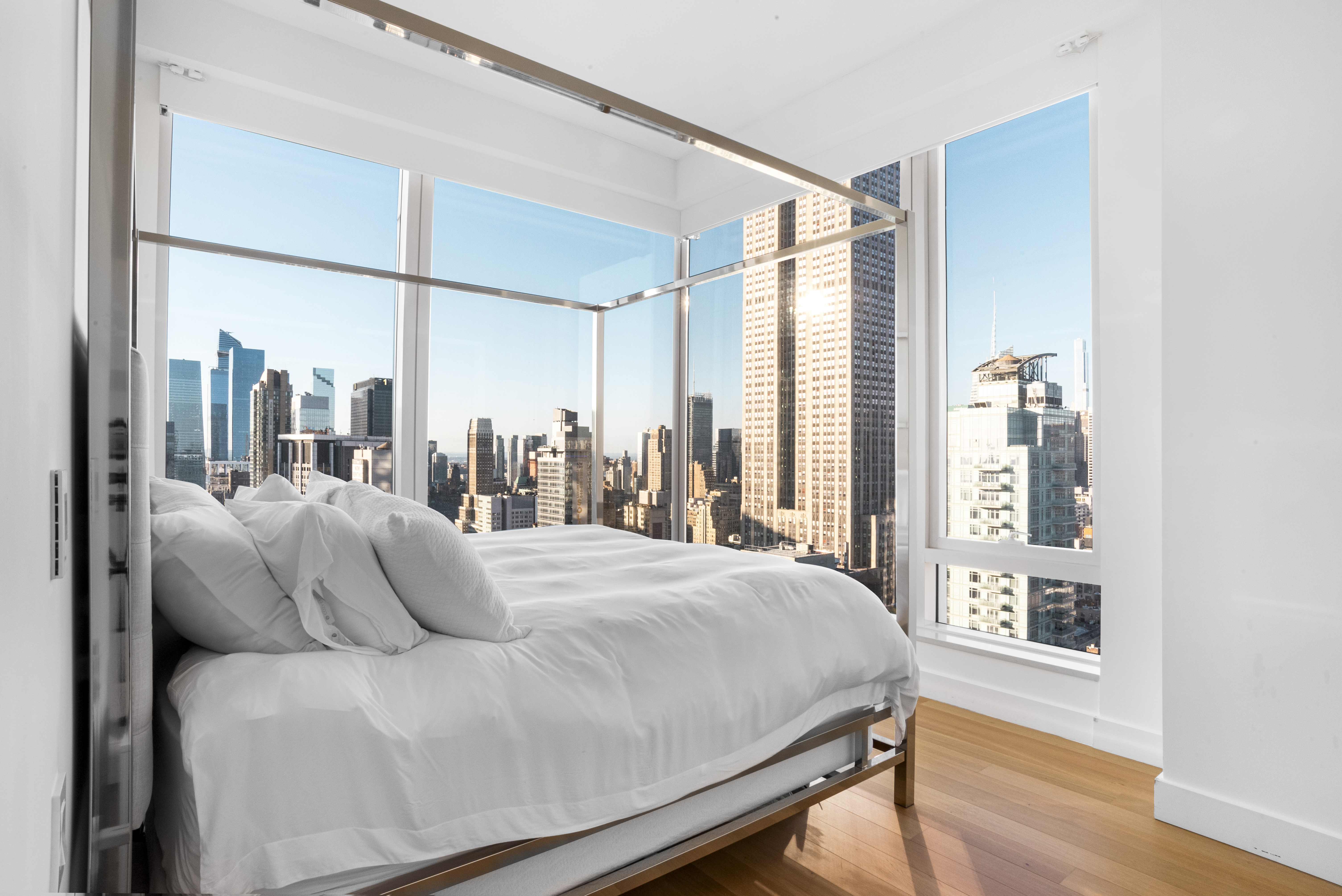 15 East 30th Street, Unit Undisclosed Manhattan, NY 10016 - Photo 7 of 23 a bedroom with a large bed and a large window