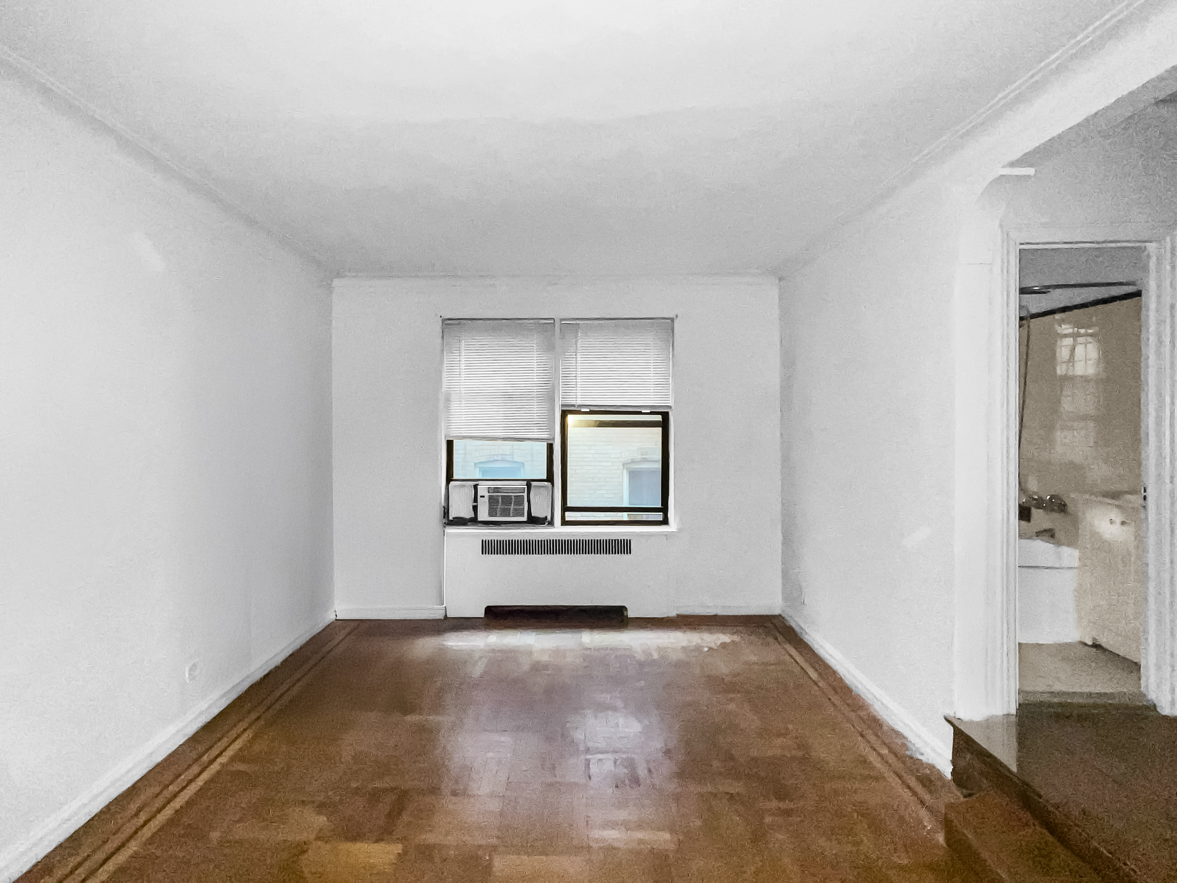2776 Jerome Avenue, Unit 3C Bronx, NY 10468 - Photo 1 of 8 a view of a livingroom with wooden floor and a rug