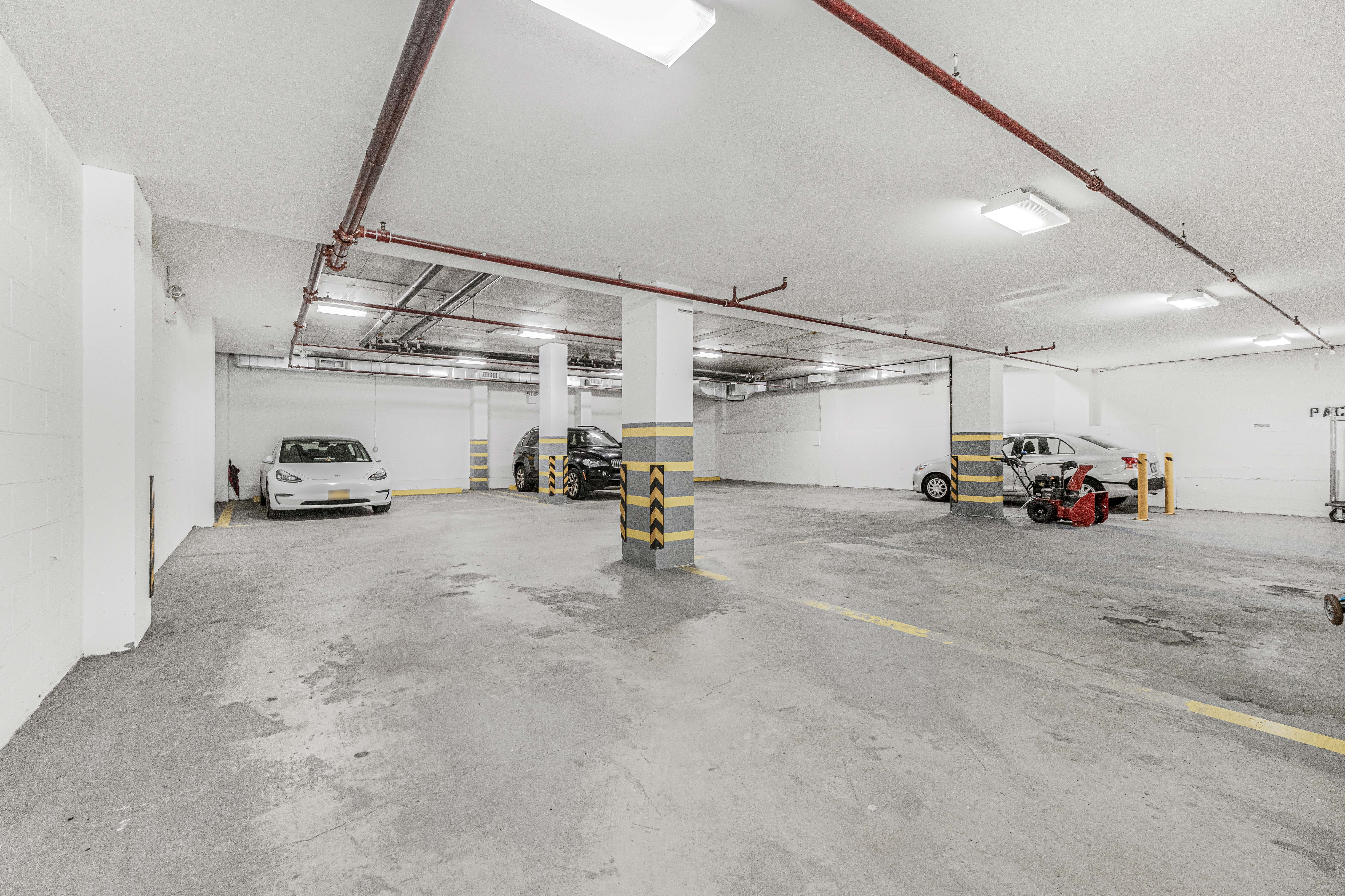 42-50 27th Street, Unit 9C Queens, NY 11101 - Photo 25 of 32 a view of parking garage with cars