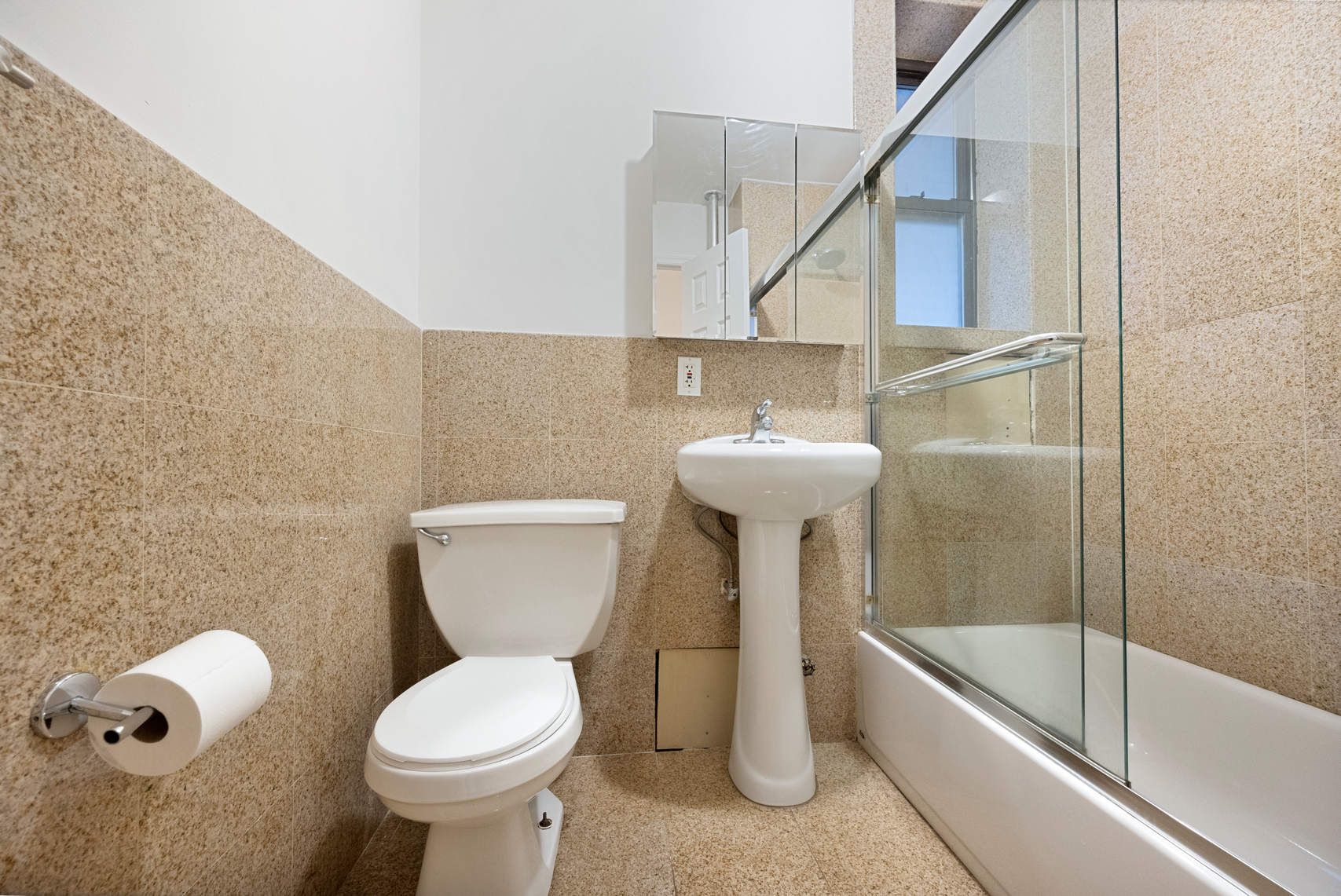 370 Columbus Avenue, Unit 4I Manhattan, NY 10024 - Photo 5 of 11 a bathroom with a sink a toilet and bathtub