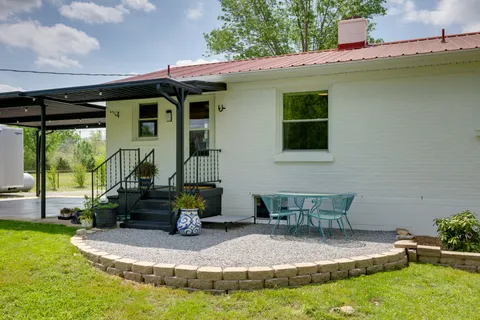 a front view of a house with a garden