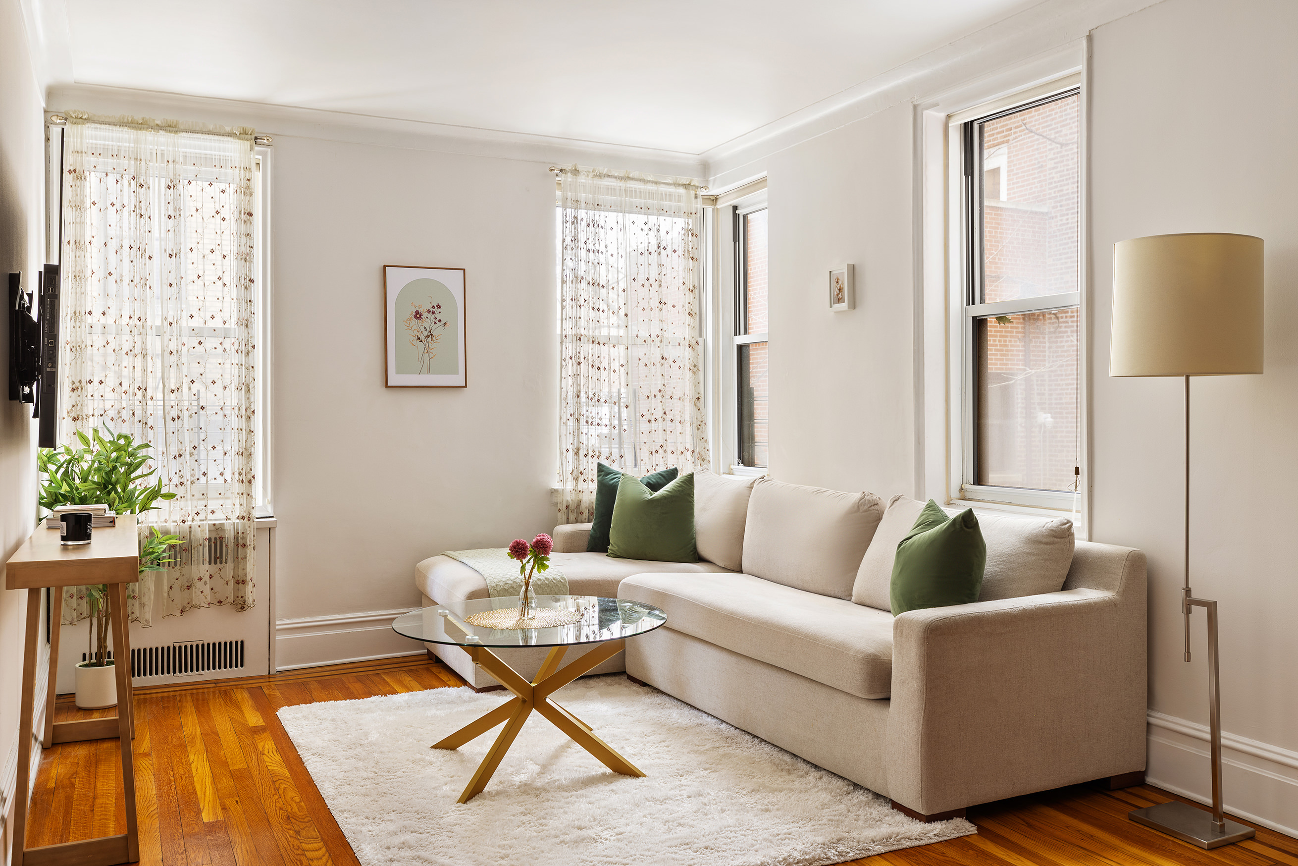 45 Plaza Street West, Unit 1F Brooklyn, NY 11217 - Photo 2 of 10 a living room with furniture and a potted plant