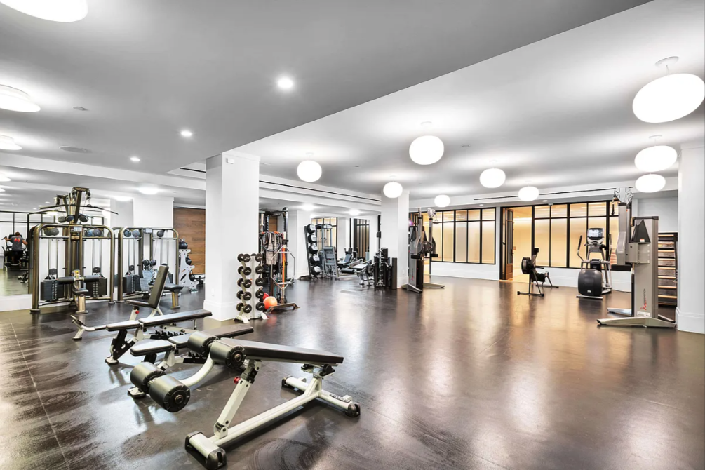 10 Madison Square West, Unit 9G Manhattan, NY 10010 - Photo 11 of 13 a view of a room with gym equipment and wooden floor