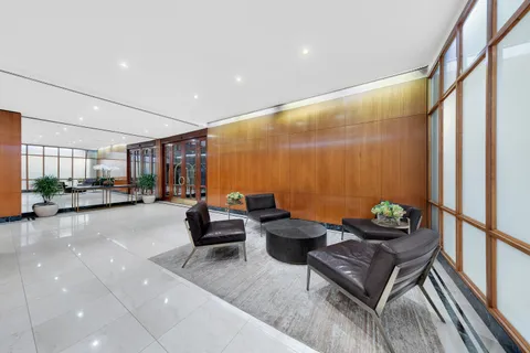 a view of a building with sitting area