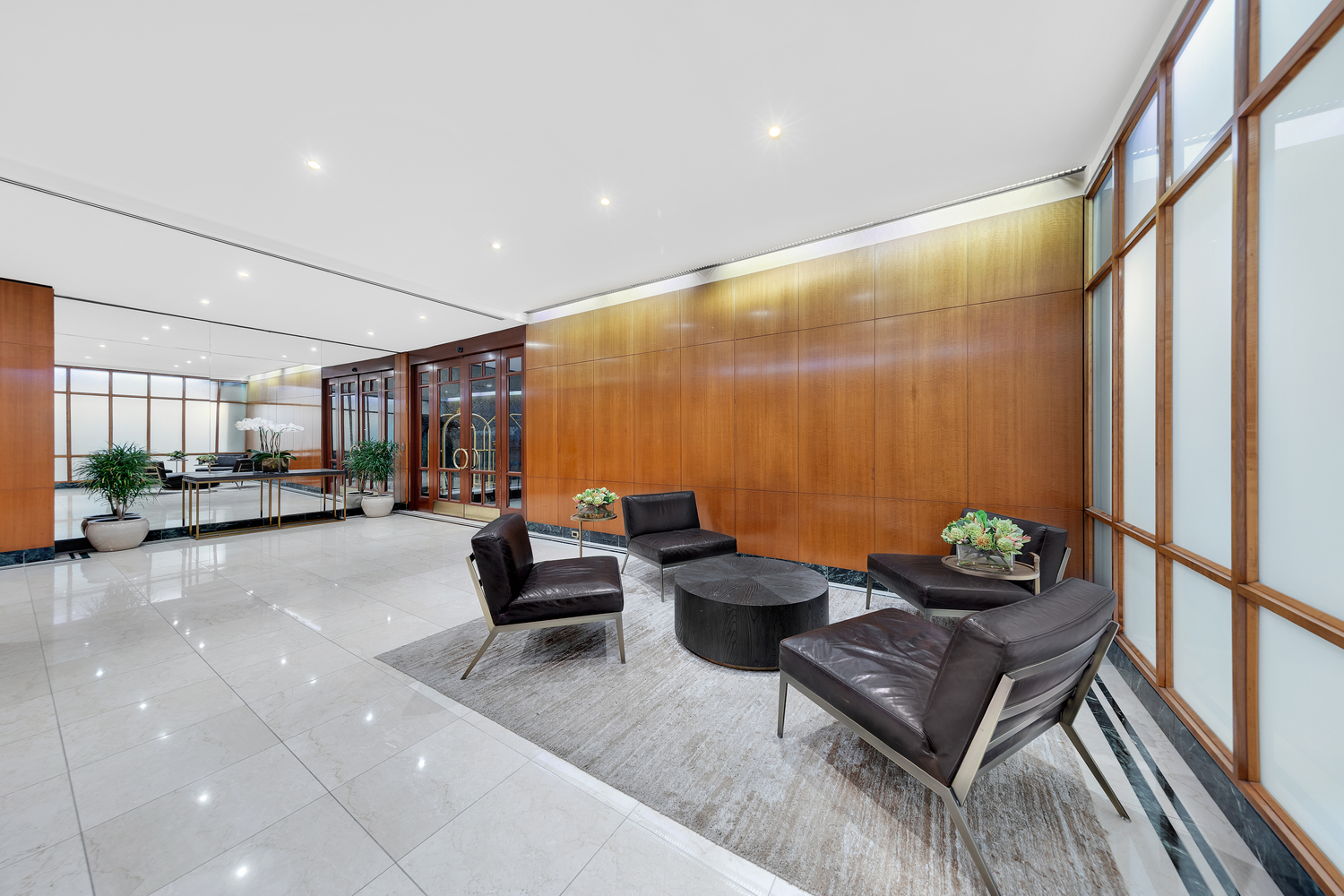 411 East 53rd Street, Unit 8C Manhattan, NY 10022 - Photo 8 of 10 a living room with furniture