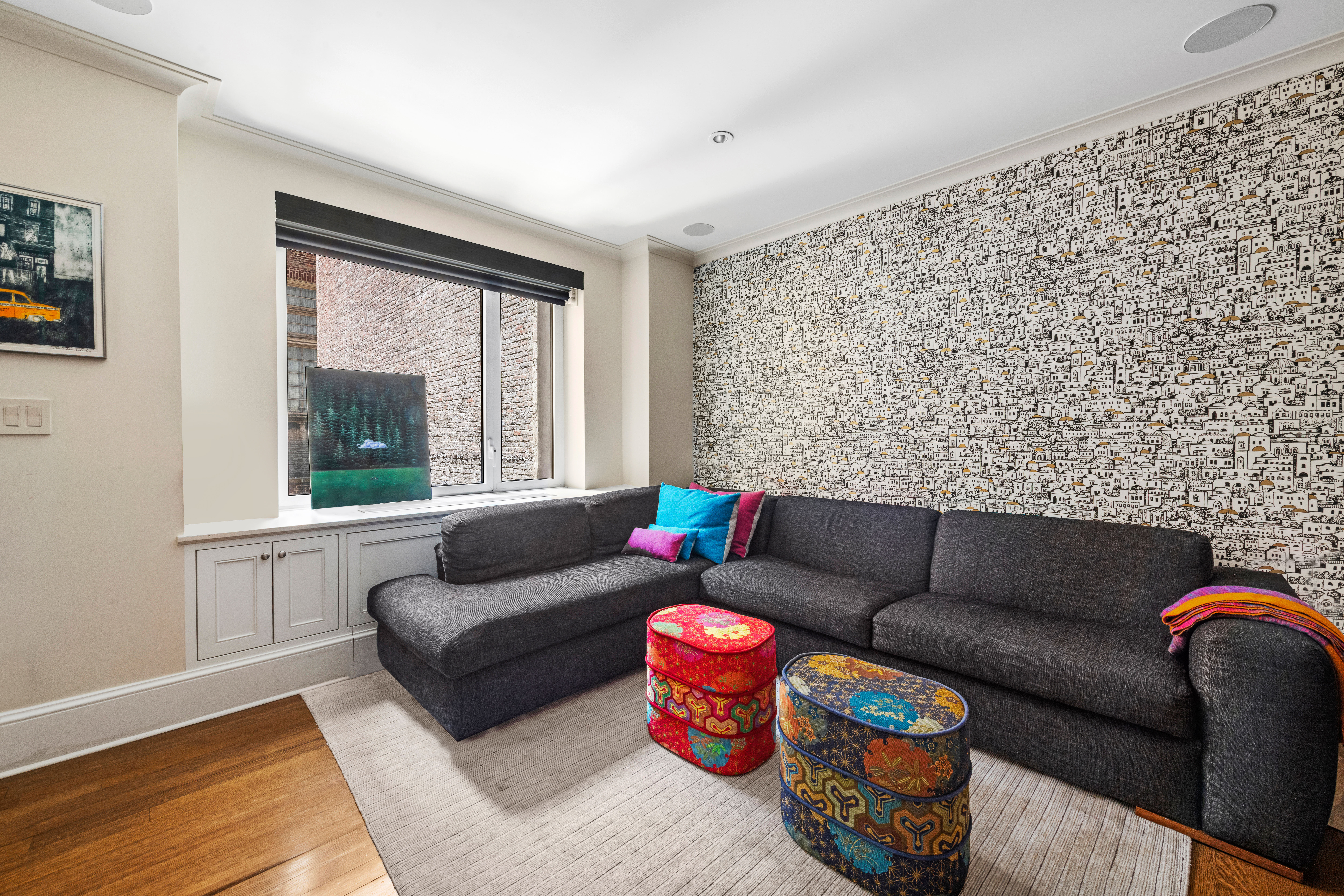 530 Park Avenue, Unit 3F Manhattan, NY 10065 - Photo 13 of 25 a living room with furniture and a large window