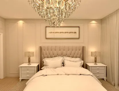 a bedroom with a bed and a chandelier