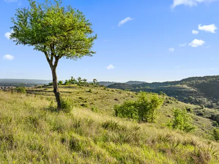 a view of lake with mountain in the background