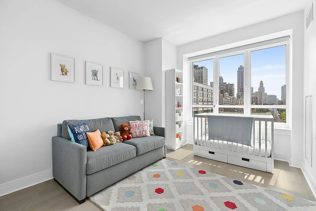265 State Street, Unit 901 Brooklyn, NY 11201 - Photo 8 of 10 a living room with furniture and a table