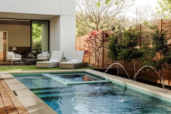 a view of a swimming pool with a lounge chair