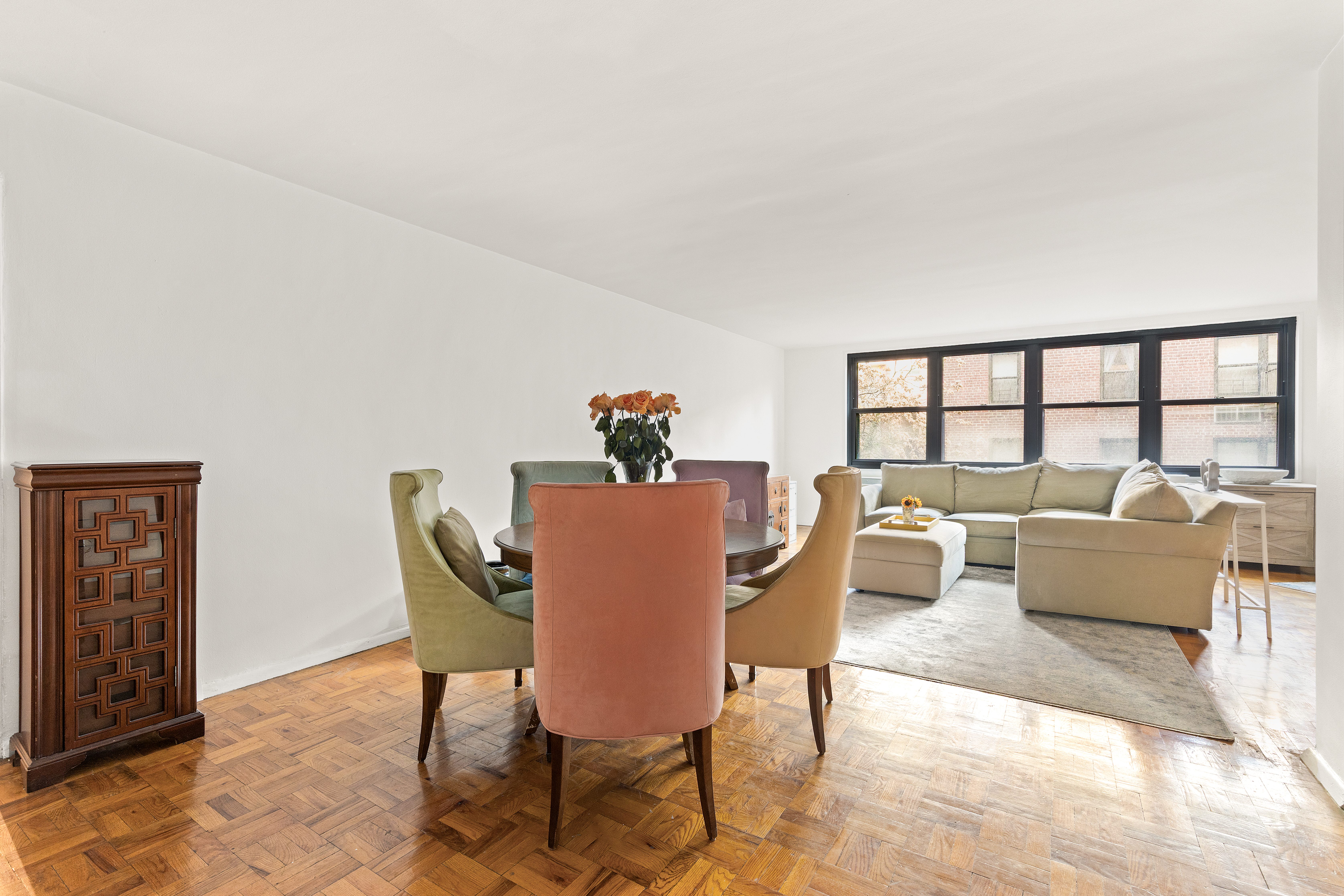 315 East 70th Street, Unit 6K Manhattan, NY 10021 - Photo 9 of 16 a dining room with furniture and a potted plant