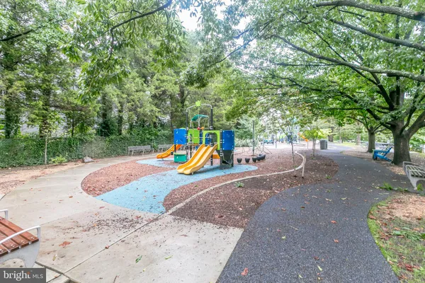 a view of a park with swings and slides