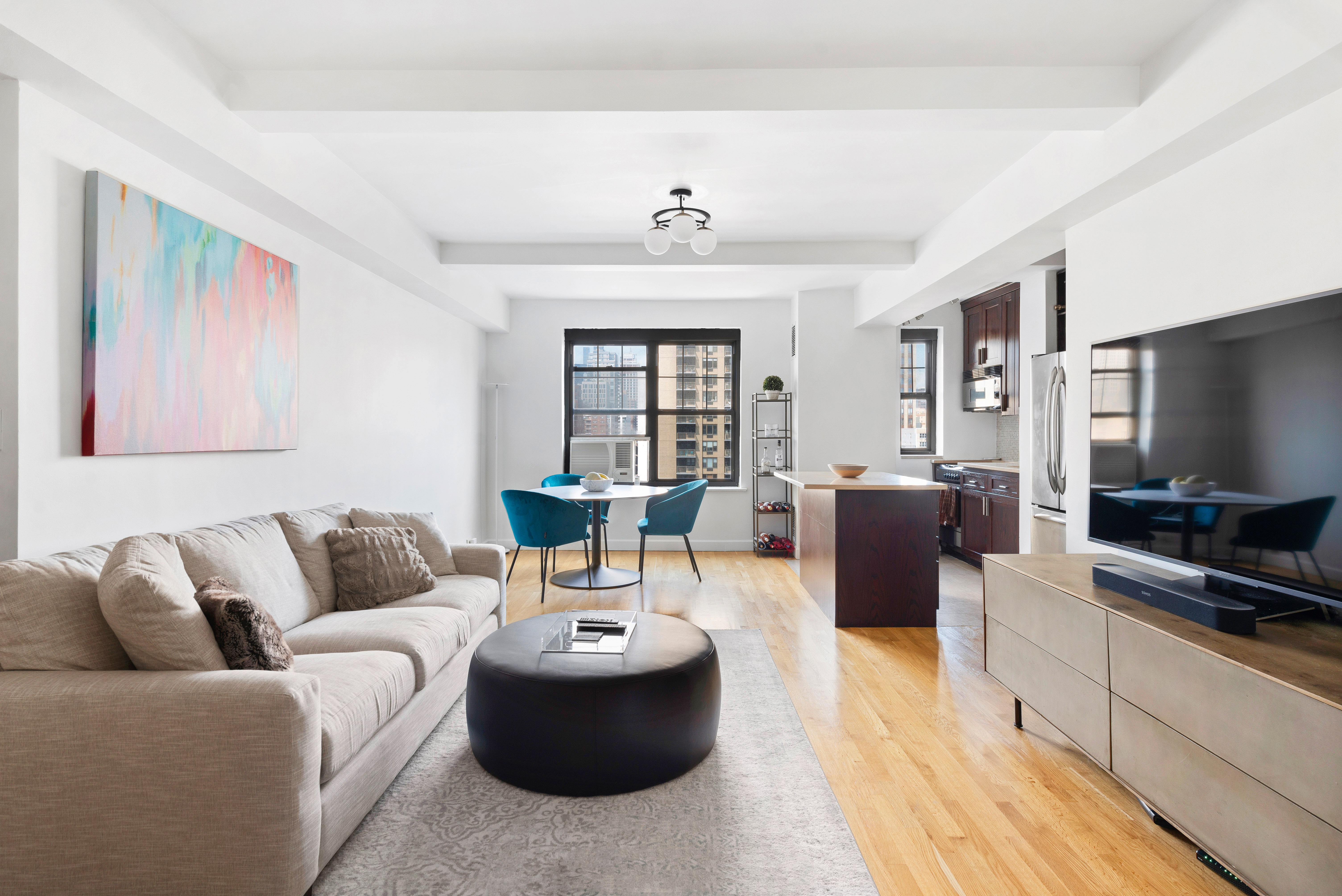 a living room with furniture and a flat screen tv