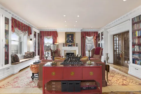 a room with table chairs and wooden floor