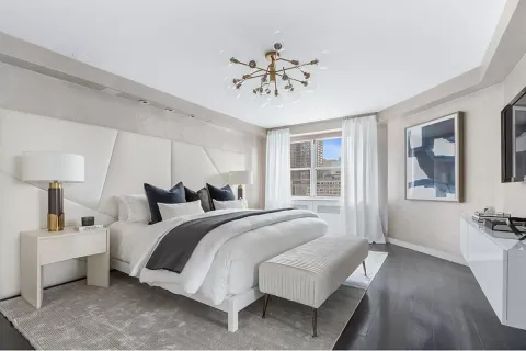 a bedroom with bed and window