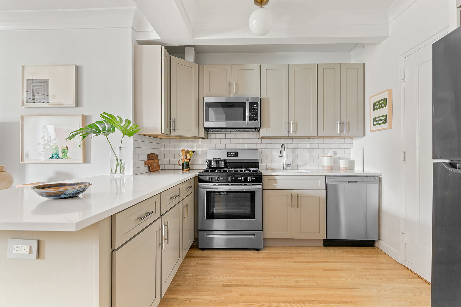 811 Cortelyou Road, Unit 2L Brooklyn, NY 11218 - Photo 3 of 10 a kitchen with stainless steel appliances granite countertop a sink and cabinets