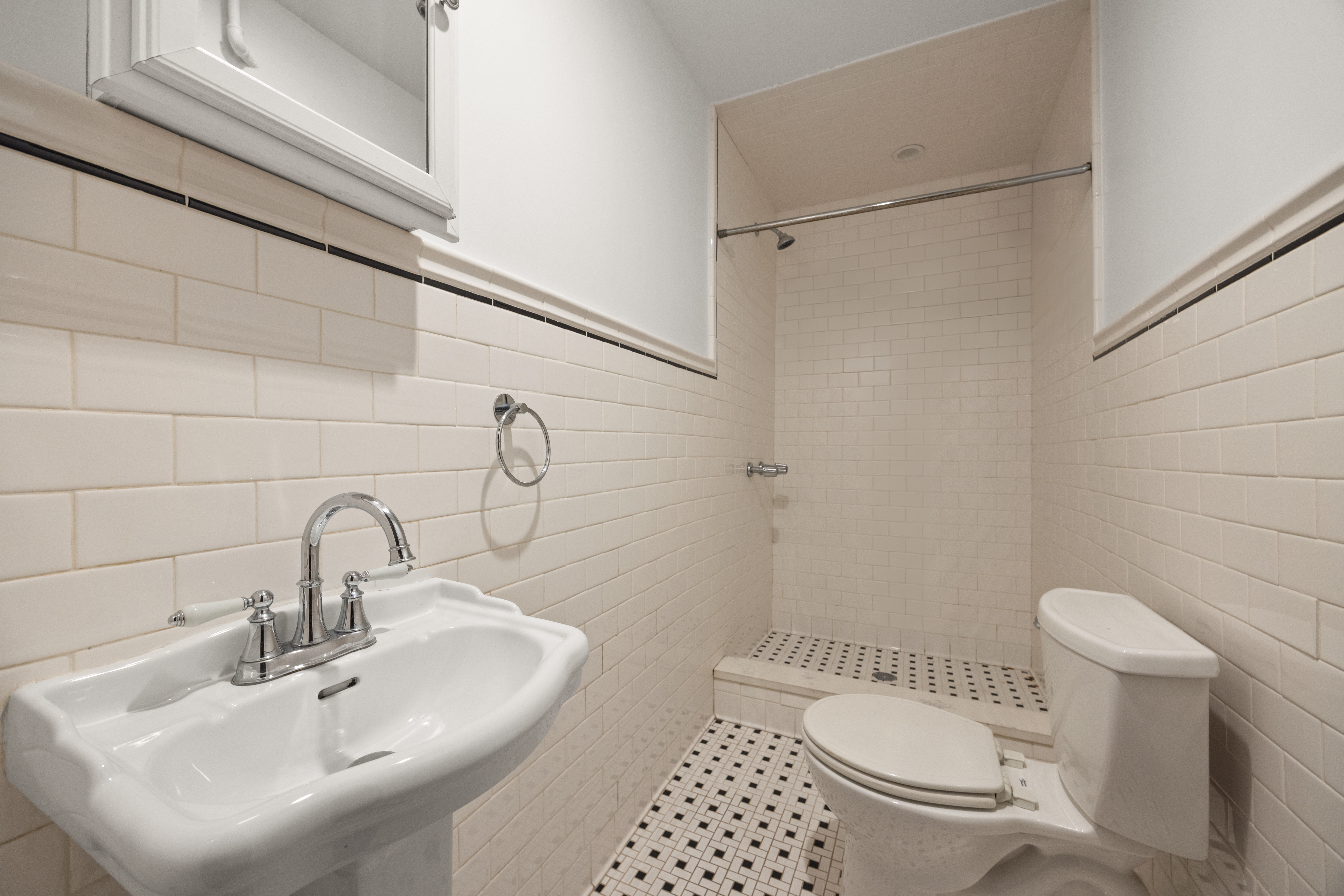 415 5th Street, Unit 1 Brooklyn, NY 11215 - Photo 11 of 14 a bathroom with a sink toilet and shower