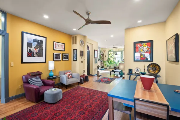 a living room with furniture and a fireplace